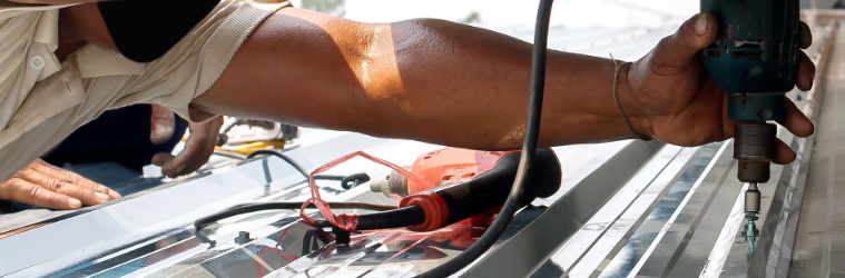 A technician installing a portable solar panel