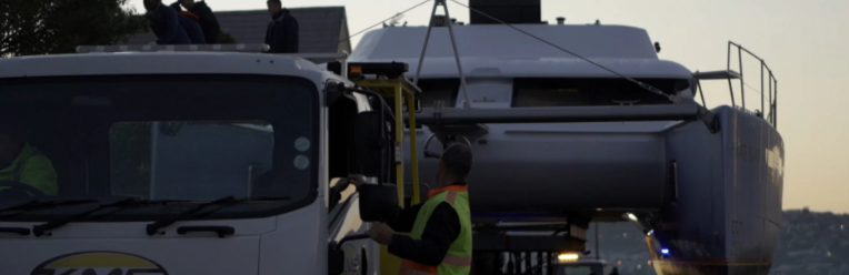 Workers assembling a luxury yacht