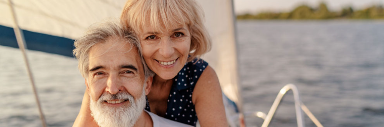 An older couple aboard a yacht